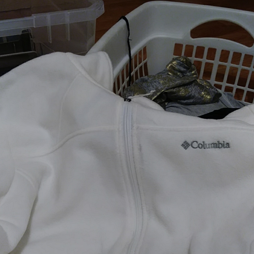 White pullover zippered Columbia jacket.